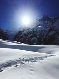 Scenic view of snow covered mountains