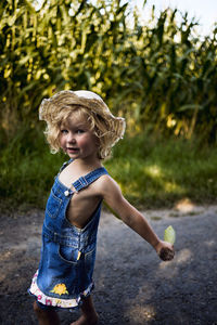 Portrait of cute girl standing outdoors