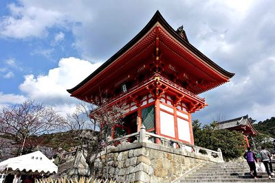 Low angle view of temple against sky during winter