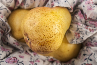 Close-up of pears on napkin