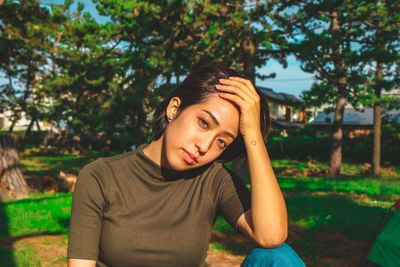 Portrait of teenage girl against plants