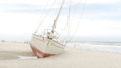 Dramatic scene of a yacht on beach 