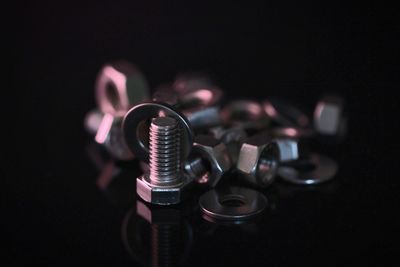 High angle view of nut and bolt against black background