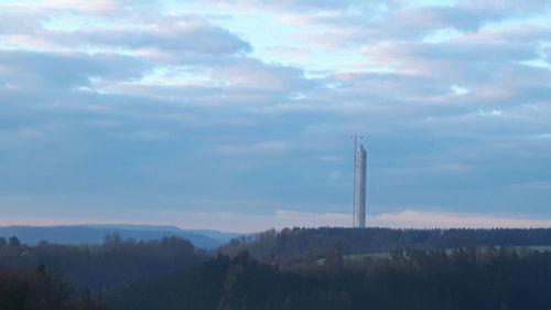 Scenic view of landscape against cloudy sky