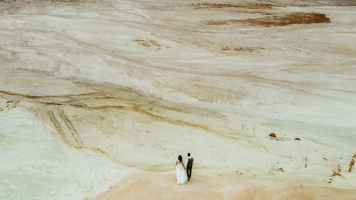 High angle view of people walking on desert