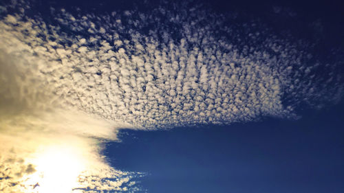 Low angle view of cloudscape over sea