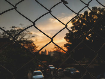 Close-up of chainlink fence against sky