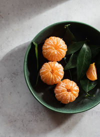 High angle view of orange fruits on leaves