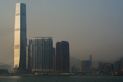 Modern buildings in city against clear sky