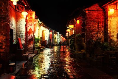 Illuminated buildings in city at night