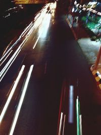 High angle view of illuminated road amidst buildings