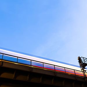 Low angle view of bridge against blue sky