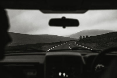 Shadow of car on road