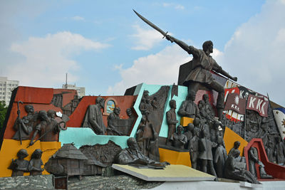 Low angle view of statue against sky