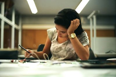 Woman sitting in pen