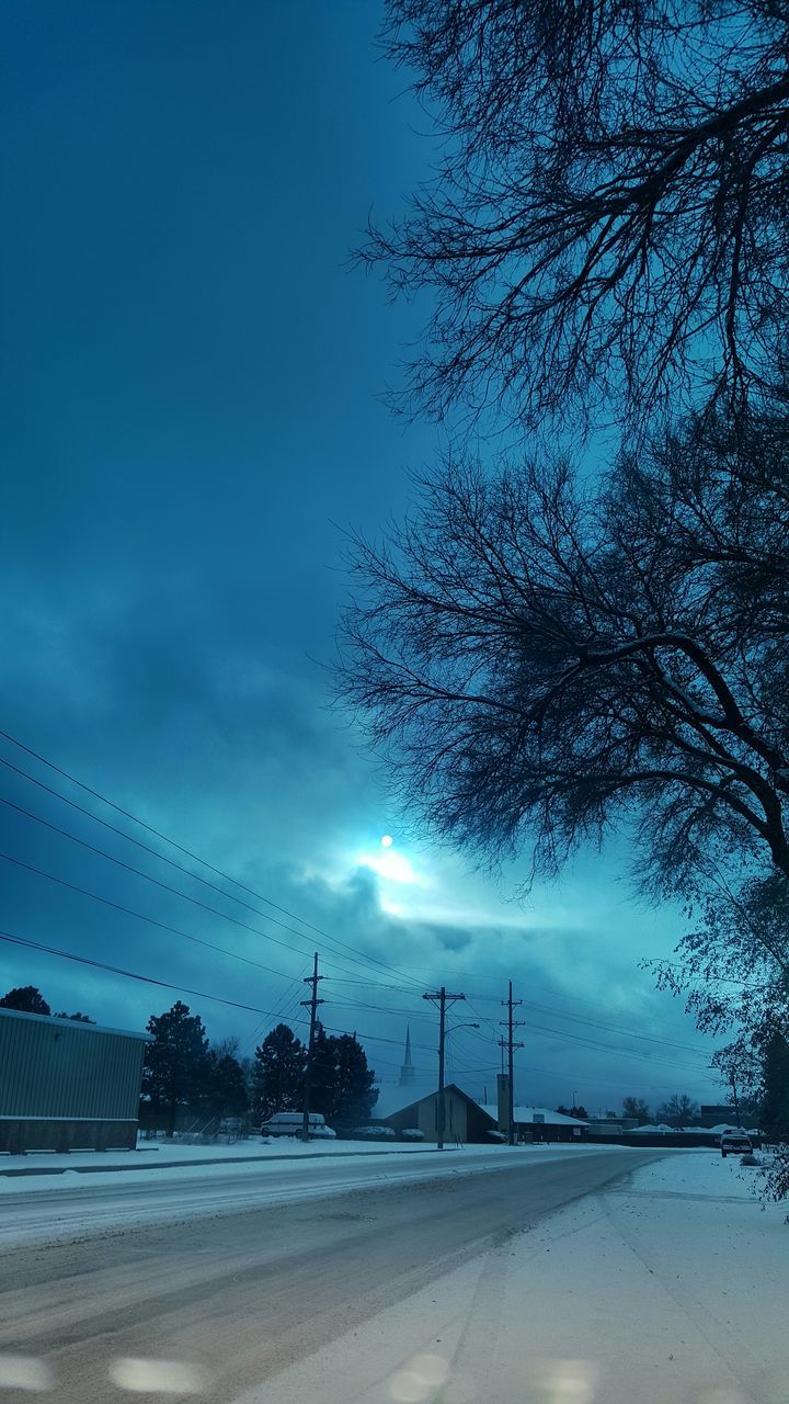 sky, transportation, road, cloud - sky, silhouette, tree, nature, tranquility, bare tree, blue, tranquil scene, street, weather, cloud, no people, car, scenics, outdoors, beauty in nature, street light