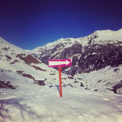 Scenic view of snow covered mountains against sky