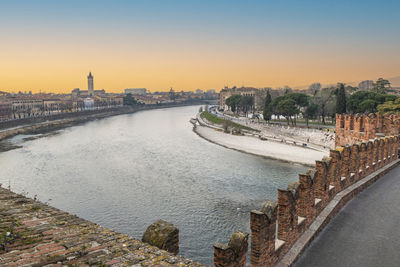 The adige river and the panorama of verona seen from the castelvecchio bridge at sunset