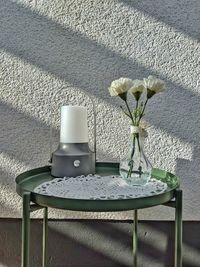 White flower vase on table