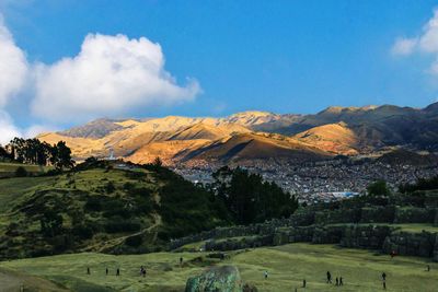 Scenic view of landscape and mountains against sky