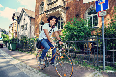 Man riding bicycle in city 