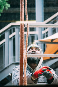 Close-up of woman standing on bench