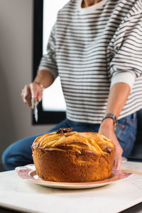 Midsection of man preparing food