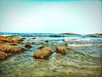 Scenic view of sea against blue sky