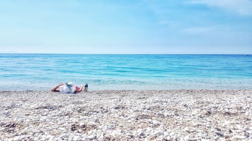 Scenic view of sea against blue sky