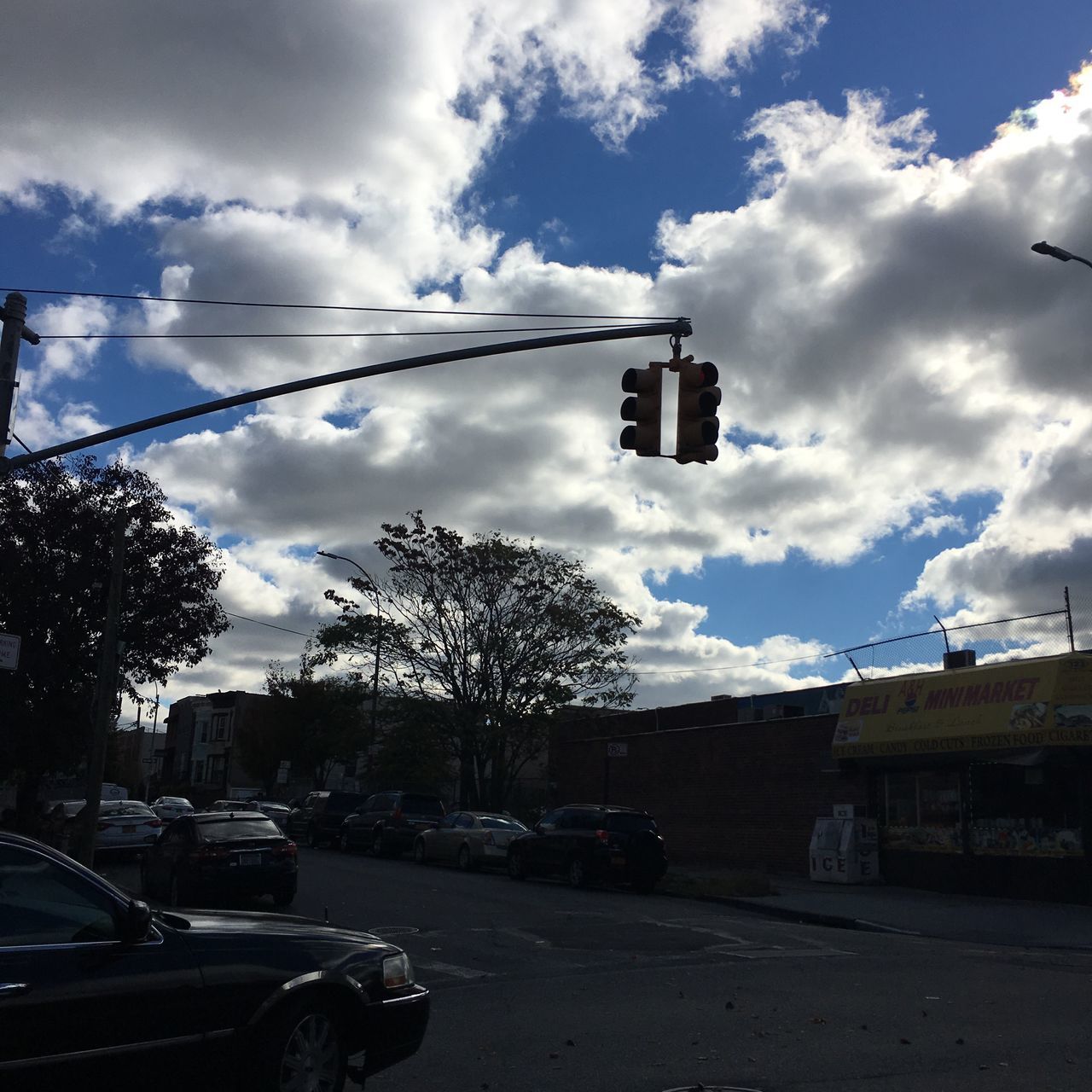 CAR ON CLOUDY SKY