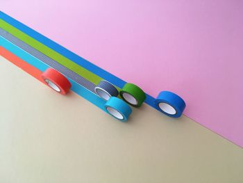High angle view of colorful duct tape rolls on table