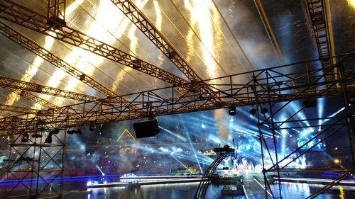 Low angle view of illuminated ceiling at night