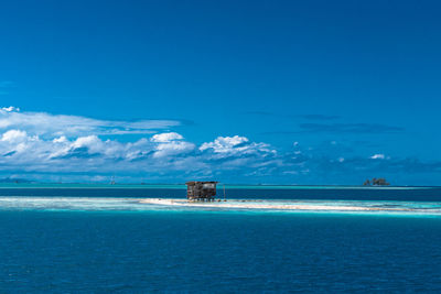 Scenic view of sea against blue sky