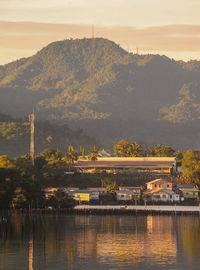 Scenic view of river against sky during sunset