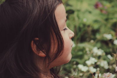 Close-up of girl with closed eyes at park