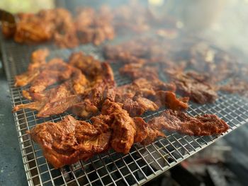 High angle view of meat on barbecue grill