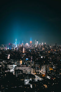 Illuminated buildings in city at night