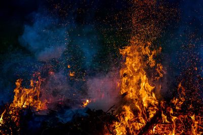 View of burning fire at night outdoors