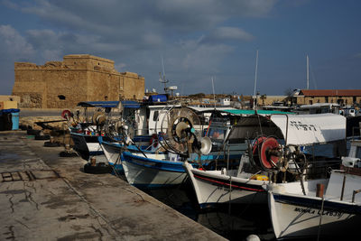 Boats moored at harbor