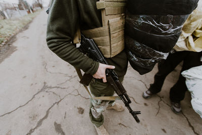 Soldier standing with machine gun