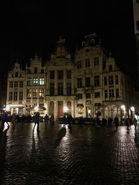 Reflection of buildings in city at night