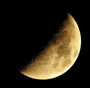 Low angle view of moon against sky at night