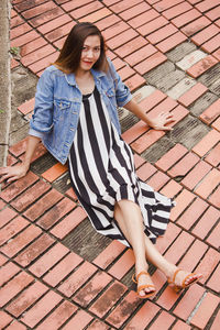 Young woman sitting outdoors