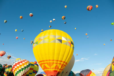 Low angle view of hot air balloons against sky
