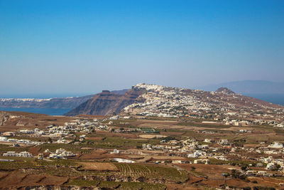 Aerial view of townscape against clear sky