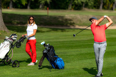 Smiling golfing couple enjoying a game of golf