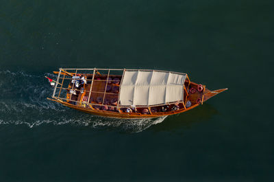 High angle view of people on boat sailing in sea