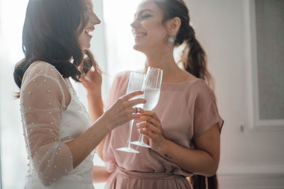 Rear view of a woman drinking glass