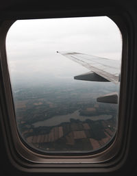 Aerial view of landscape seen through airplane window