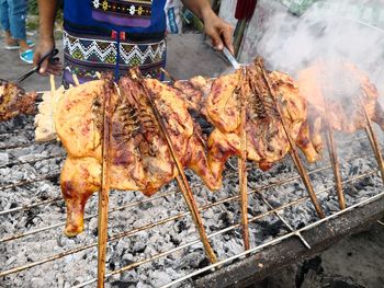 Man preparing food on barbecue grill